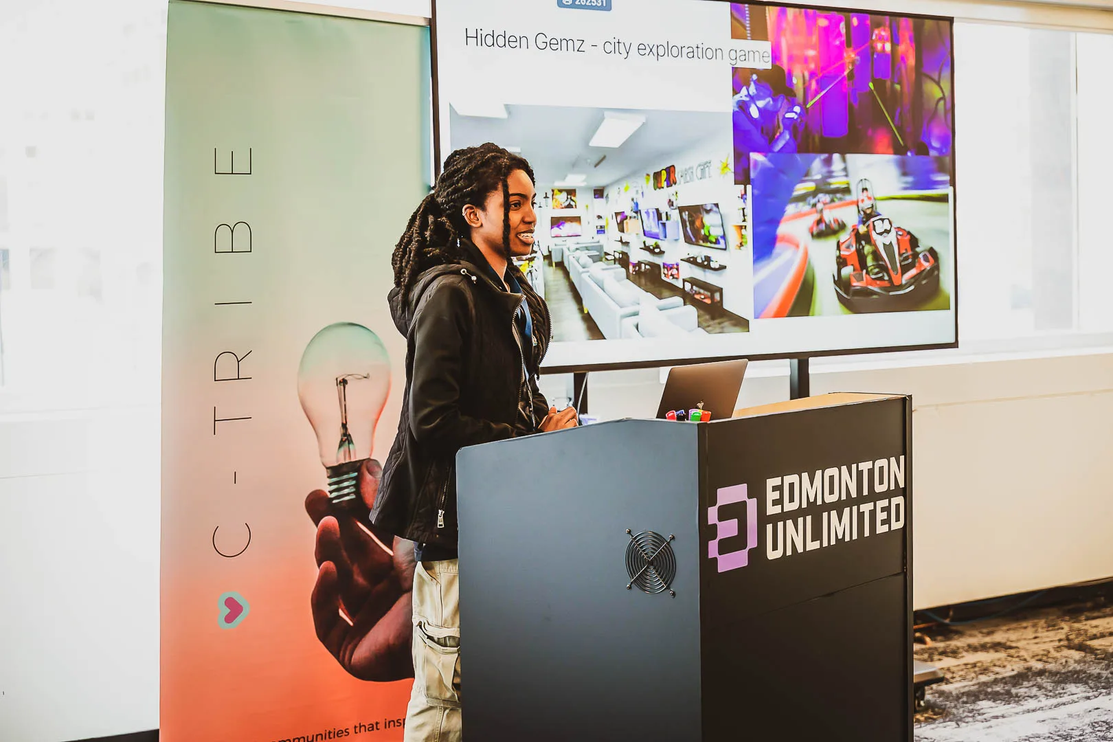 A speaker on stage at C-Tribe Festival