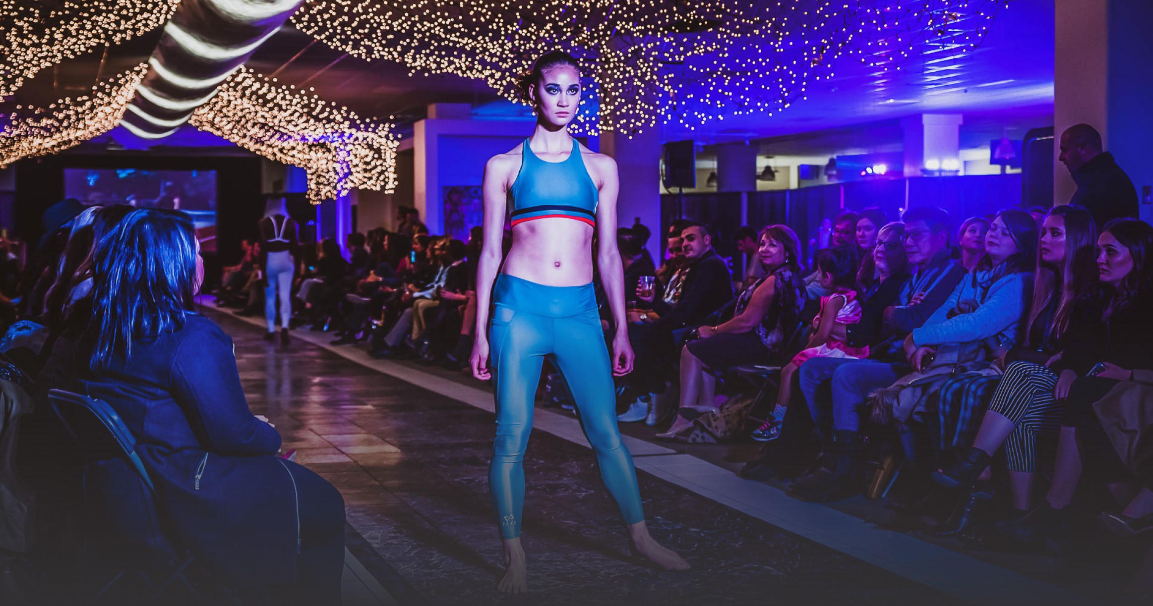Audience watching a C-Tribe x Fashion runway show